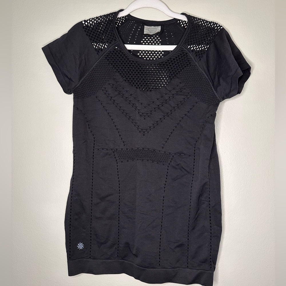 Athleta black women’s workout top with fishnet style holes breathable